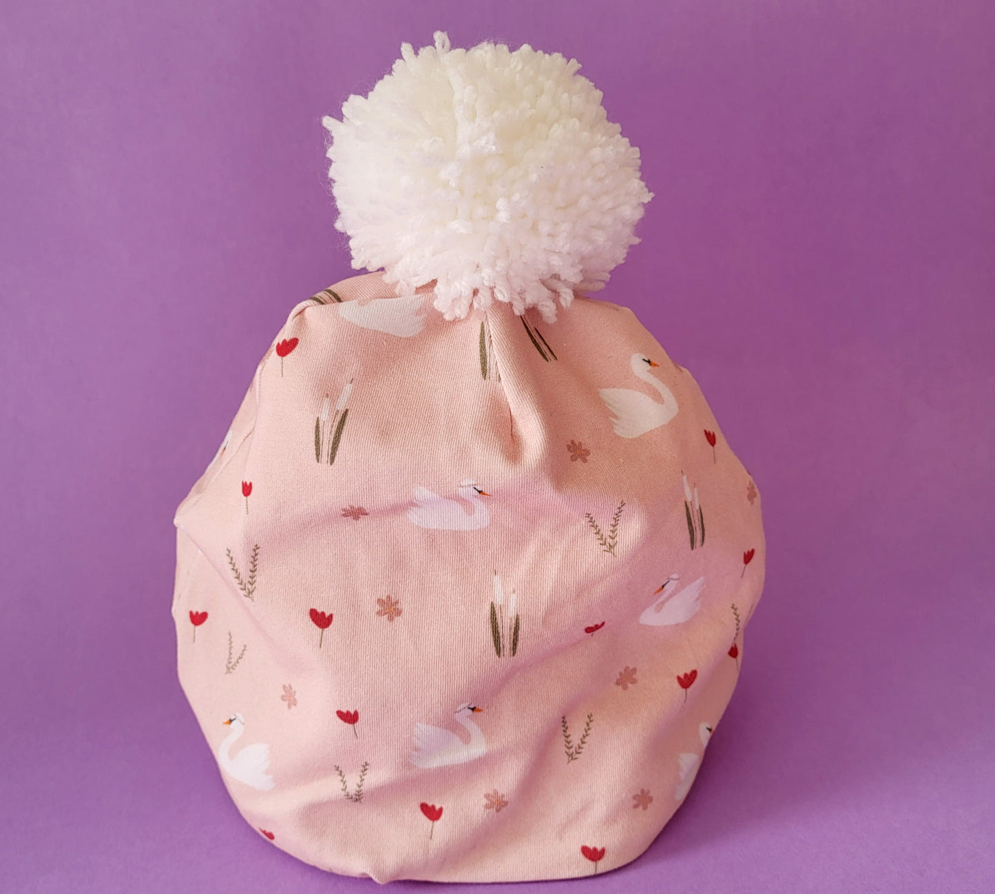 Cappellino con pom pom