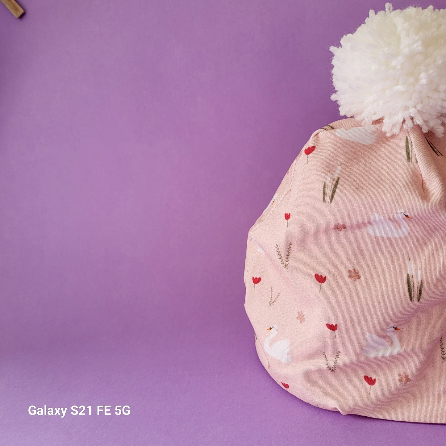 Cappellino con pom pom